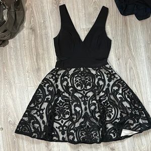 A vneck dress with peek-a-boo sides. A-line